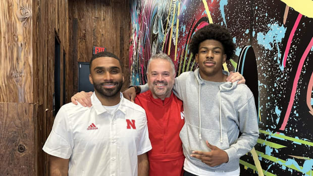 Braylen Prude with Nebraska defensive backs coach Evan Cooper and head coach Matt Rhule.